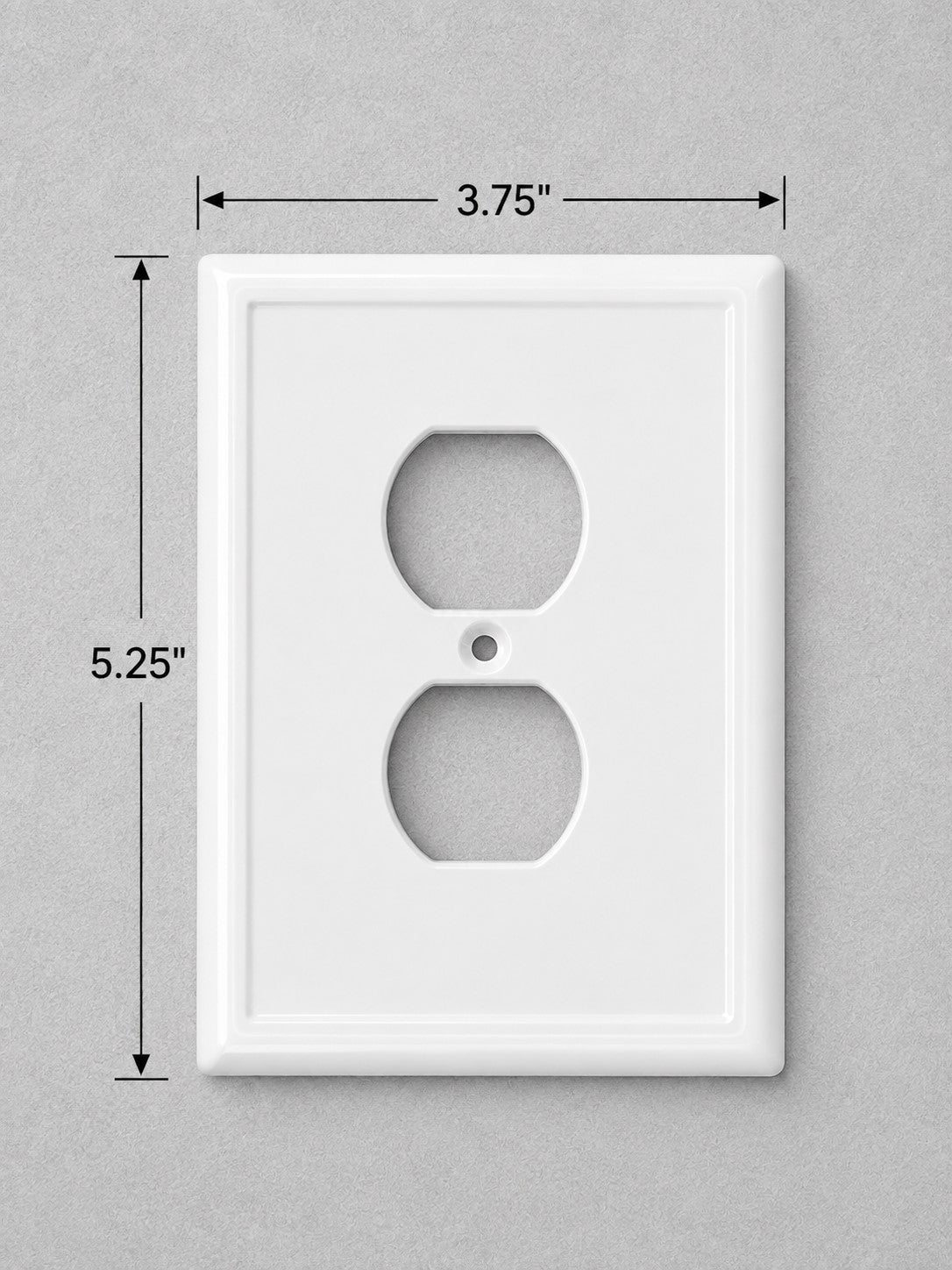 White standard outlet wall plate shown on a light gray background with dimension lines and text indicating 3.75 inches wide by 5.25 inches high.